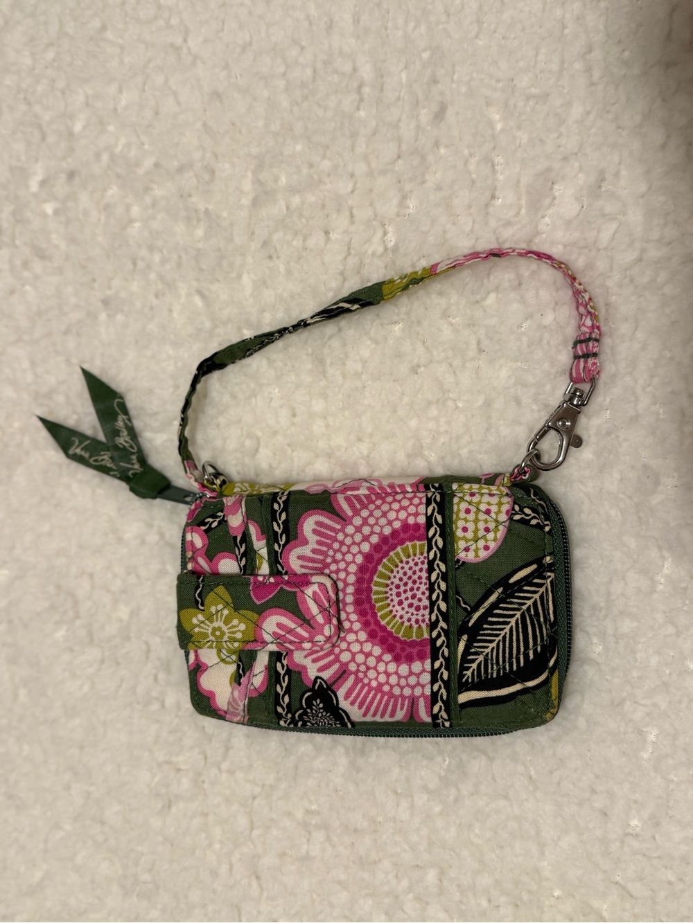 Vera Bradly Olivia Pink wristlet featuring a vibrant green and pink pattern